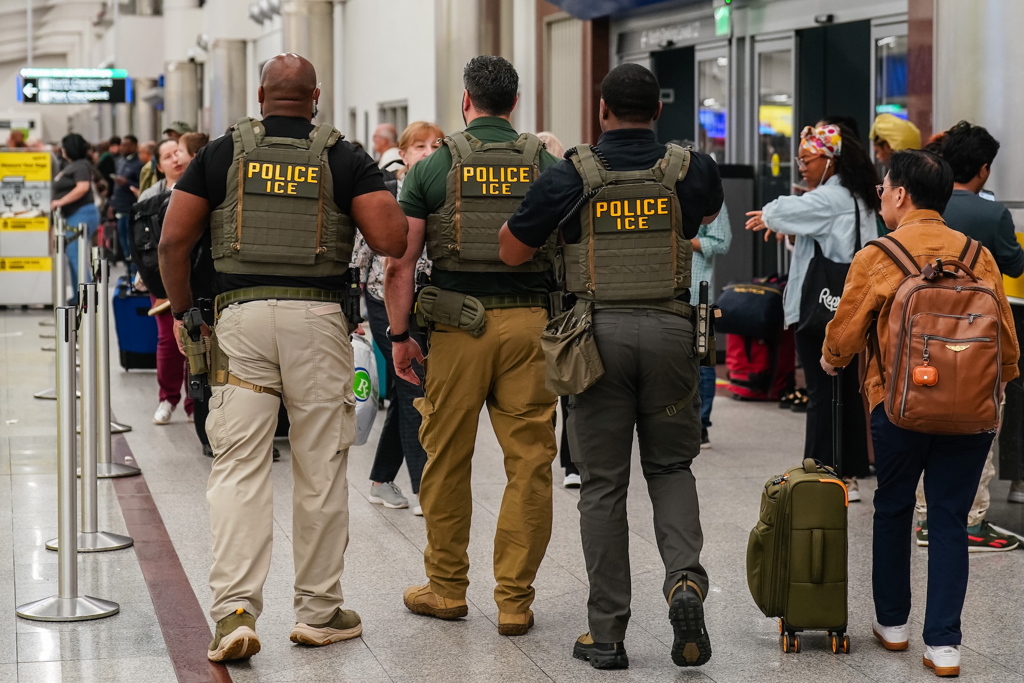 Controversial Federal Deployment: Immigration Enforcement Officers Patrolling U.S. Airports Amidst Government Standoff
